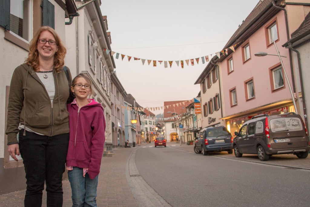 Miranda and Phoenix along the main street in Kandern, in the early evening. Many of the streets/buildings look like this, and above many shops are apartments.