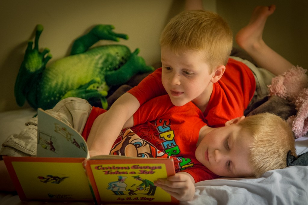 Nightcrawler (top) reads one of our Curious George books to Beast (bottom). They were supposed to be going to sleep. It was so beautiful a moment that I didn't have the heart to change it, so I grabbed the camera instead.