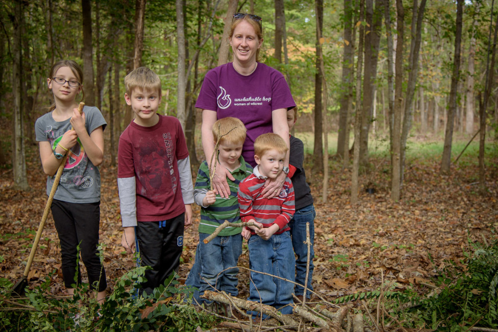 Everyone pitched in, even the twins. Here, we stand behind one of the brush piles we made in the woods just away from the Griffin home. 