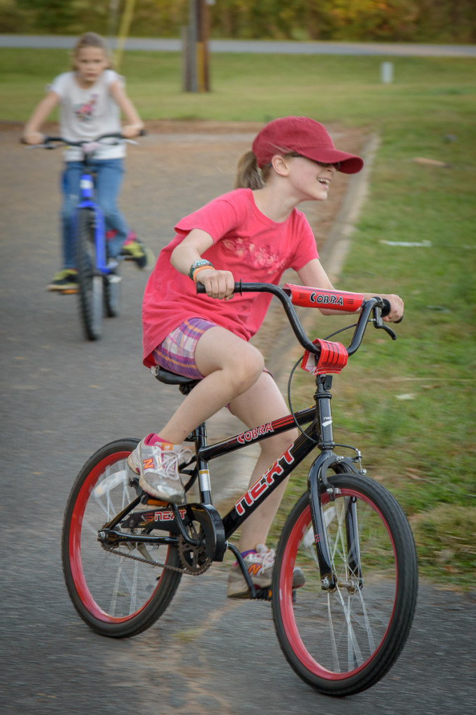 Phoenix rounds the last corner in the bike race, with the second-place rider just behind her. She really enjoyed the race.