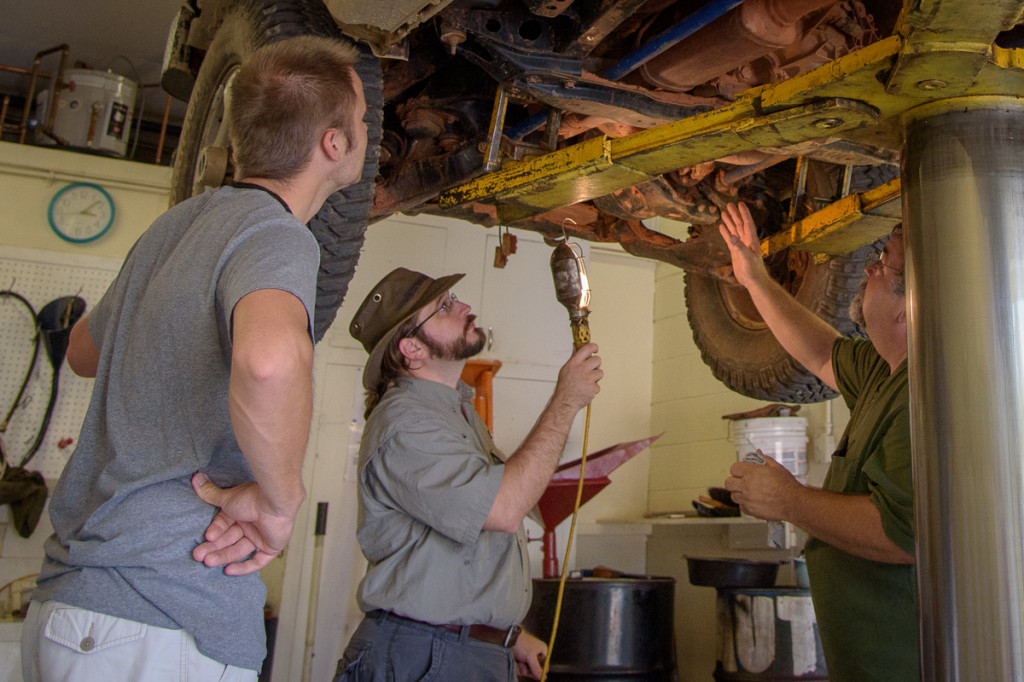 Mike is showing Erik and me the front differential and/or transfer case on the Trooper. Despite everything being caked with mud, we were able to get a peek at all of the major drive train components.