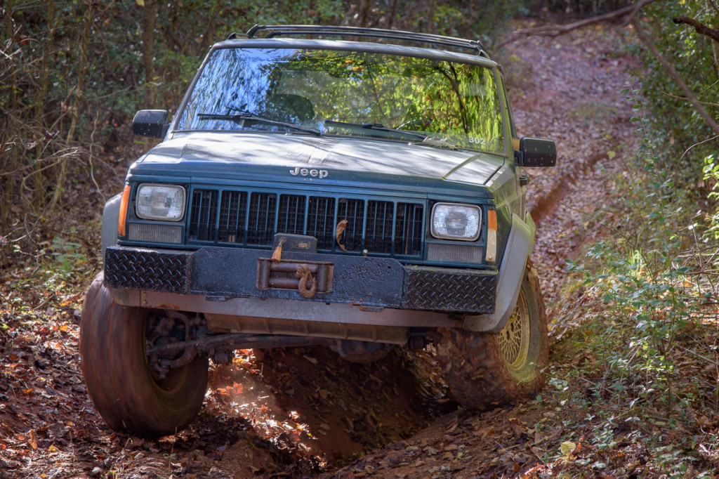 We drove the '96 Jeep Cherokee on both courses today. On this part of the second course, the washed-out section shifts from left to right, as we bounce through.